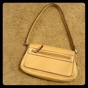A tan little satchel